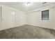 A bedroom with carpet, closet, and a window at 2660 Julian St, Denver, CO 80211