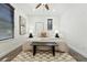 A modern bedroom with neutral walls, ceiling fan, and checkerboard rug at 2660 Julian St, Denver, CO 80211