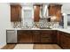 A charming kitchen with stainless appliances, white quartz counters, and custom cabinets at 2660 Julian St, Denver, CO 80211