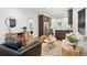 Stylish living room with modern furniture, open to the kitchen, and natural light throughout at 2660 Julian St, Denver, CO 80211