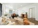 Inviting living room with comfortable seating, stylish decor, and easy access to the dining area at 2660 Julian St, Denver, CO 80211