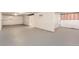 Unfinished basement with gray flooring and high ceilings at 4501 S Lipan Ct, Englewood, CO 80110