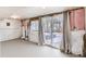 Unfinished basement room with sliding glass door to backyard at 4501 S Lipan Ct, Englewood, CO 80110