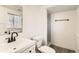 Clean bathroom with white vanity, toilet and shower at 4501 S Lipan Ct, Englewood, CO 80110