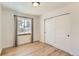 Light and airy bedroom with hardwood floors and sliding doors at 4501 S Lipan Ct, Englewood, CO 80110
