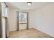 Bright bedroom with hardwood floors and a window at 4501 S Lipan Ct, Englewood, CO 80110
