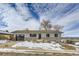 Ranch style home with stone accents and a two-car garage at 4501 S Lipan Ct, Englewood, CO 80110