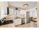 Modern kitchen with stainless steel appliances and butcher block counters at 4501 S Lipan Ct, Englewood, CO 80110