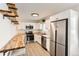 Updated kitchen featuring stainless steel appliances and white cabinetry at 4501 S Lipan Ct, Englewood, CO 80110