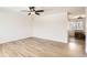Open living room with hardwood floors and access to dining area at 4501 S Lipan Ct, Englewood, CO 80110