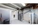 Unfinished basement with furnace and water heater at 7020 Avrum Dr, Denver, CO 80221