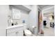 Clean bathroom with white vanity and shower stall at 7020 Avrum Dr, Denver, CO 80221