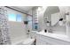 Clean bathroom with white vanity and subway tile at 7020 Avrum Dr, Denver, CO 80221