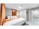 Comfortable bedroom with king-size bed and adjacent bathroom at 7020 Avrum Dr, Denver, CO 80221