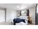 Spacious bedroom with king-size bed and plush blanket at 7020 Avrum Dr, Denver, CO 80221