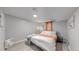 Serene bedroom with a king-size bed and window at 7020 Avrum Dr, Denver, CO 80221