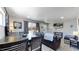 Open concept dining area with modern table and chairs at 7020 Avrum Dr, Denver, CO 80221