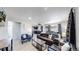 Spacious living room with a leather couch and modern coffee table at 7020 Avrum Dr, Denver, CO 80221
