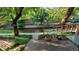 Backyard patio and canal featuring mature trees and landscaping at 1633 18Th St # 2, Boulder, CO 80302