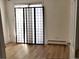 Bedroom featuring wood floors, a heater, and a decorative room divider at 1633 18Th St # 2, Boulder, CO 80302