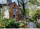 Beautiful creek running behind homes, with mature trees, foliage, and walking path for residents to enjoy at 1633 18Th St # 2, Boulder, CO 80302
