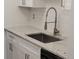 Close-up of kitchen sink and counter with modern fixtures and subway tile backsplash at 1633 18Th St # 2, Boulder, CO 80302