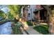 Cozy outdoor patio near a creek, with seating and foliage at 1633 18Th St # 2, Boulder, CO 80302