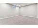 Spacious finished basement with neutral carpeting and a window for natural light at 770 S Arbutus St, Lakewood, CO 80228