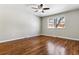 Well-lit bedroom with hardwood floors and ceiling fan at 770 S Arbutus St, Lakewood, CO 80228