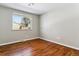 Bright bedroom with hardwood floors and large window at 770 S Arbutus St, Lakewood, CO 80228