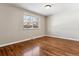 Spacious bedroom with hardwood floors and a window at 770 S Arbutus St, Lakewood, CO 80228