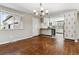 Open concept dining area with kitchen access and hardwood floors at 770 S Arbutus St, Lakewood, CO 80228