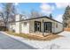 Rear view of the house showing patio and backyard at 770 S Arbutus St, Lakewood, CO 80228