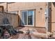 Back patio with brick flooring and sliding glass door access, perfect for outdoor relaxing and entertaining at 3706 S Fairplay Way, Aurora, CO 80014
