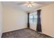 Bedroom with ceiling fan, ample natural light, and soft carpeting at 3706 S Fairplay Way, Aurora, CO 80014