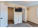 Bedroom with double closets, wall mounted TV and neutral carpeting throughout at 3706 S Fairplay Way, Aurora, CO 80014