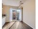Bright dining area featuring wood floors and sliding glass doors at 3706 S Fairplay Way, Aurora, CO 80014