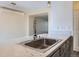 Close-up of kitchen sink with marble counter and modern fixtures at 3706 S Fairplay Way, Aurora, CO 80014