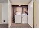Laundry room with washer and dryer, showcasing functionality and convenience within the home's layout at 3706 S Fairplay Way, Aurora, CO 80014