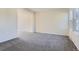 Spacious living room with plush carpeting, neutral walls, and natural light at 3706 S Fairplay Way, Aurora, CO 80014