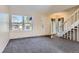 Inviting living room with plush carpet, a bright window, and an open floor plan at 3706 S Fairplay Way, Aurora, CO 80014
