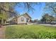 Spacious backyard featuring a well-maintained lawn and chain-link fencing, perfect for outdoor activities and privacy at 6411 E 64Th Ave, Commerce City, CO 80022
