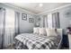 Comfortable bedroom with soft natural light, grey walls, cozy linens, and stylish decor create a cozy space at 6411 E 64Th Ave, Commerce City, CO 80022