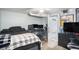 Cozy bedroom with gaming setup, comfortable bed, and ample space for relaxation and entertainment at 6411 E 64Th Ave, Commerce City, CO 80022