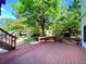 Enjoy the backyard view from this spacious back deck with wood banister and bench at 9466 Morning Glory Ln, Highlands Ranch, CO 80130