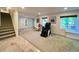 Spacious basement featuring neutral carpet and a large massage chair with nearby windows at 9466 Morning Glory Ln, Highlands Ranch, CO 80130