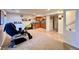 Cozy basement with carpet, kitchenette, and walkout door providing access to the backyard at 9466 Morning Glory Ln, Highlands Ranch, CO 80130