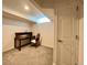 Finished basement featuring carpeted floors and a desk area at 9466 Morning Glory Ln, Highlands Ranch, CO 80130
