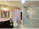 Beautiful bathroom featuring a glass shower enclosure and an updated vanity with ample lighting at 9466 Morning Glory Ln, Highlands Ranch, CO 80130