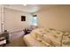 Bedroom featuring neutral carpet, natural light, and a comfortable layout at 9466 Morning Glory Ln, Highlands Ranch, CO 80130